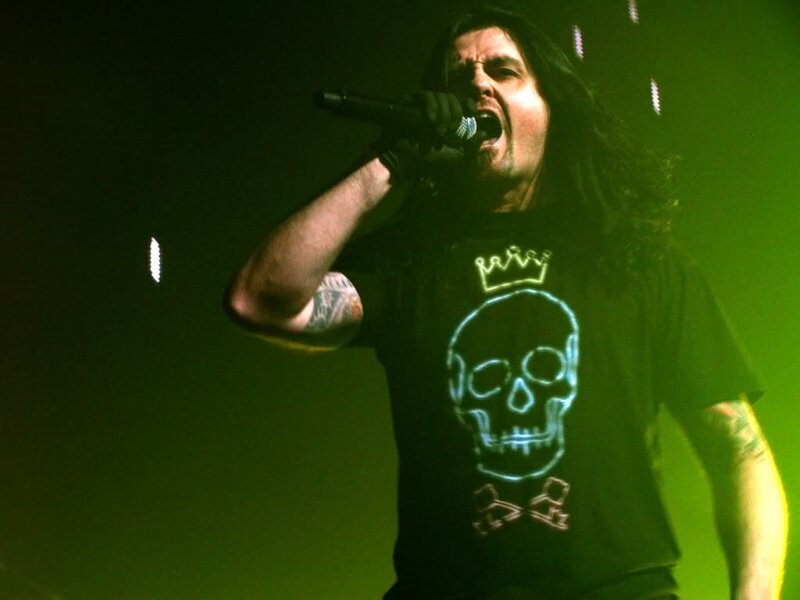 Man Singing on Stage — Green