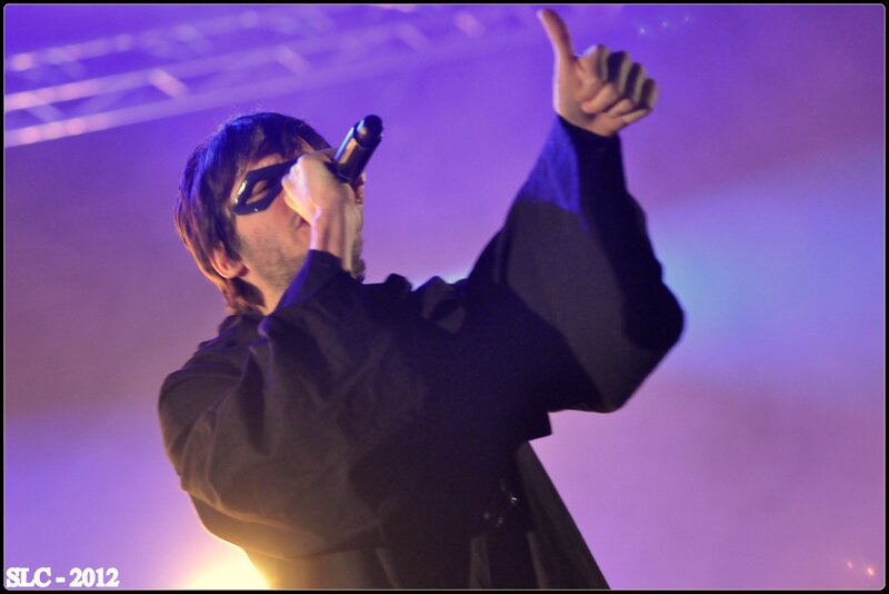 Man Singing on Stage — Purple, Dramatic, Night, Photograph, Microphone, Stage Lights