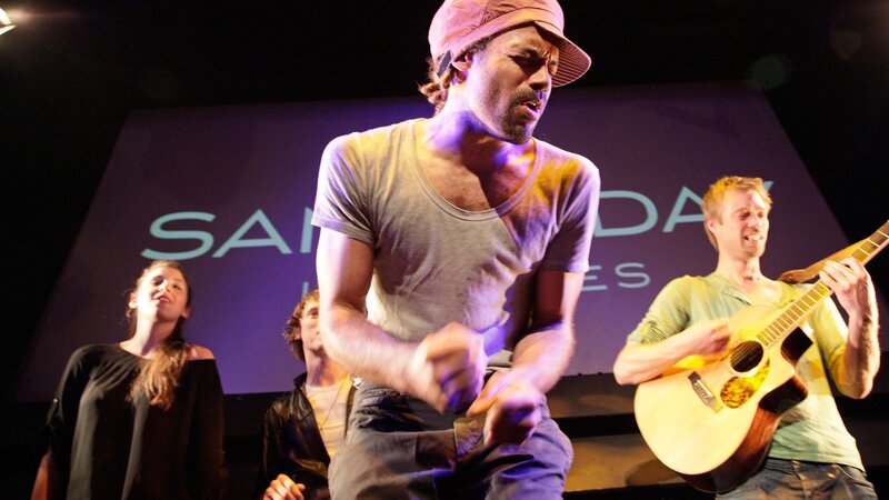 Man Singing on Stage — Purple, Dramatic, Night
