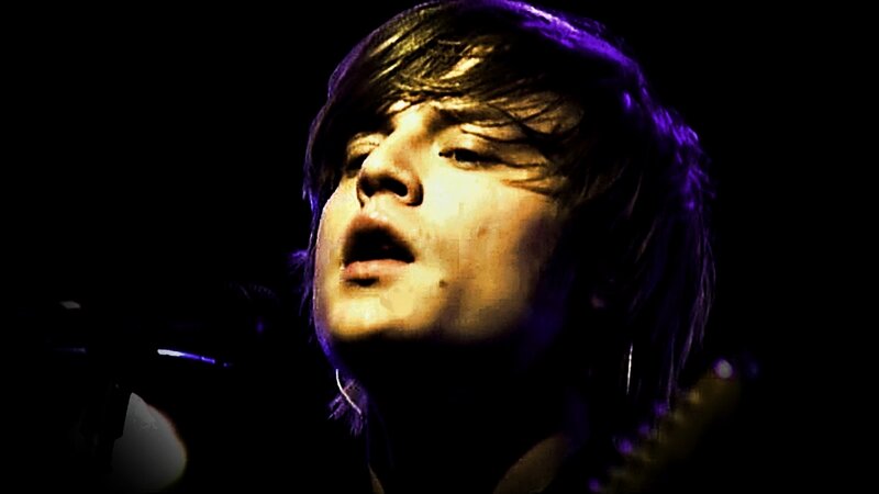 Man Singing on Stage — Purple