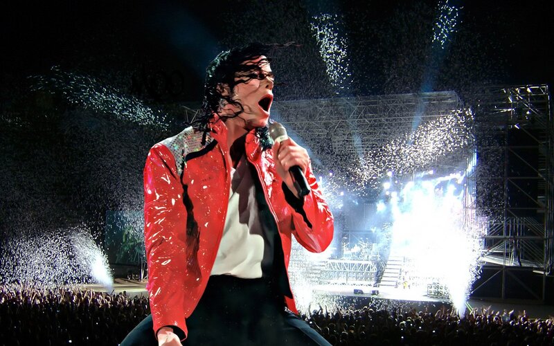 Man Singing on Stage — Red, Energetic, Night