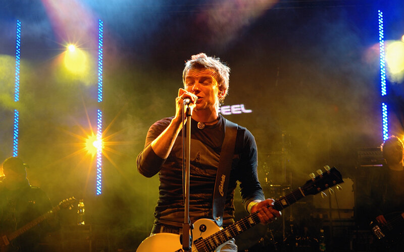 Man Singing on Stage — Yellow