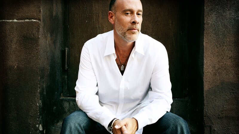 Man Sitting Against Wall — White