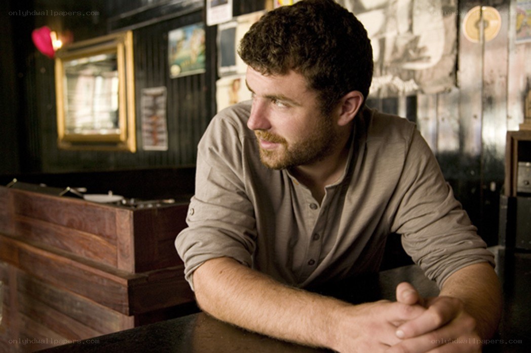 man sitting at a bar