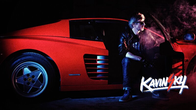 Man Sitting by Car — Red