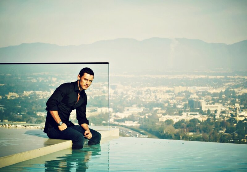 Man Sitting by Pool — Blue