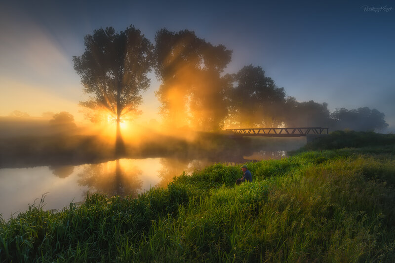 Man Sitting by River — Green