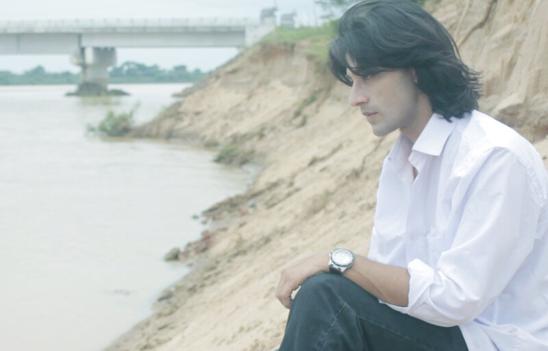 Man Sitting by River — White