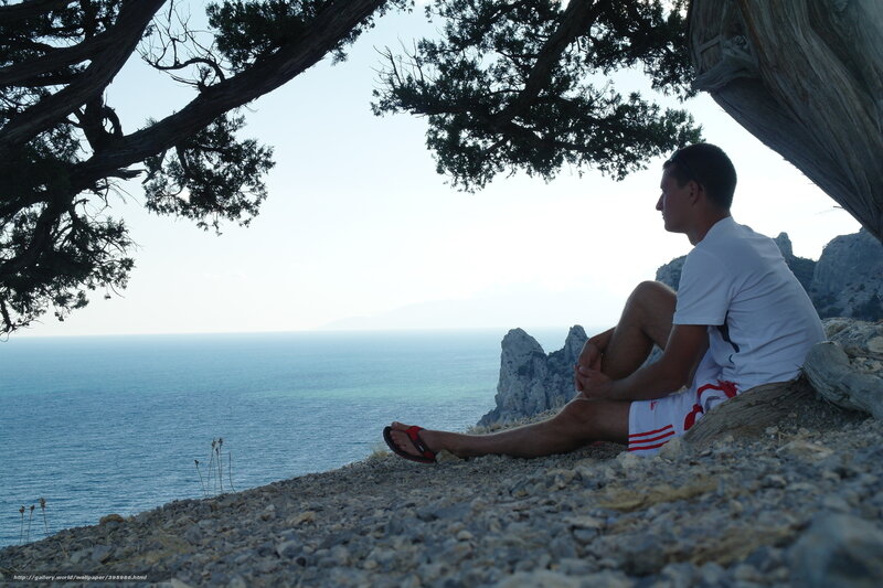 Man sitting by the sea