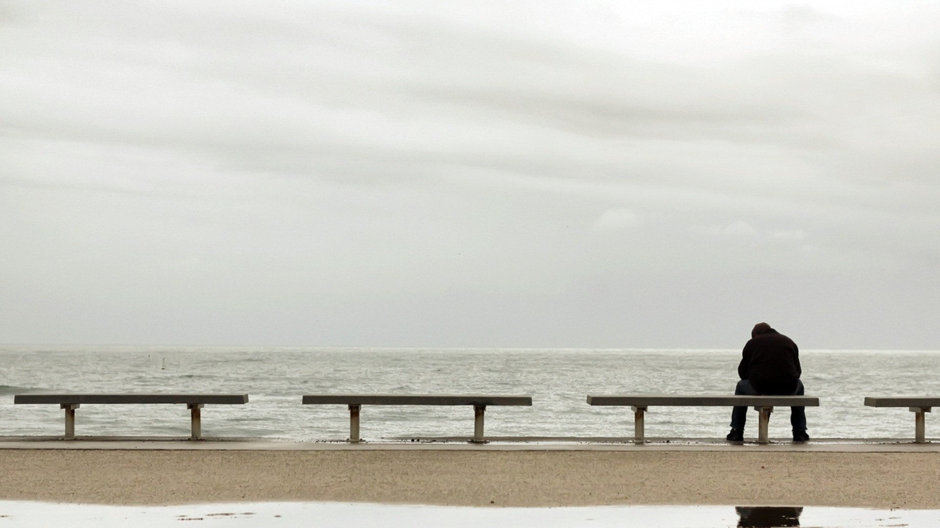 Man sitting by the sea