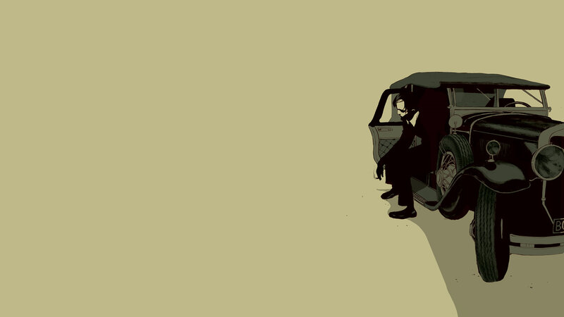 man sitting by vintage car