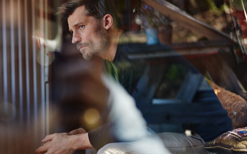 man sitting by window