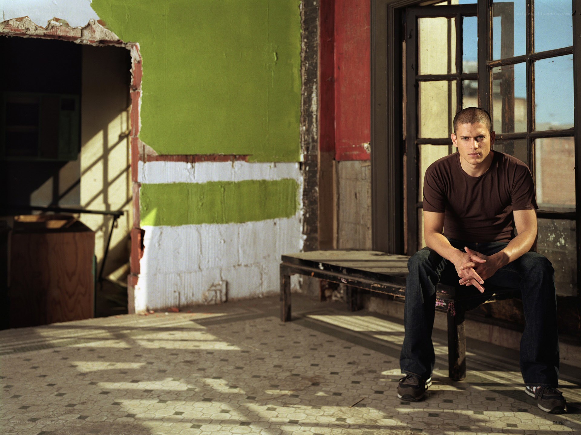 man sitting in abandoned building
