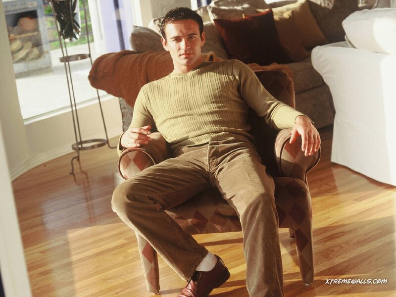 Man Sitting in Armchair — Brown
