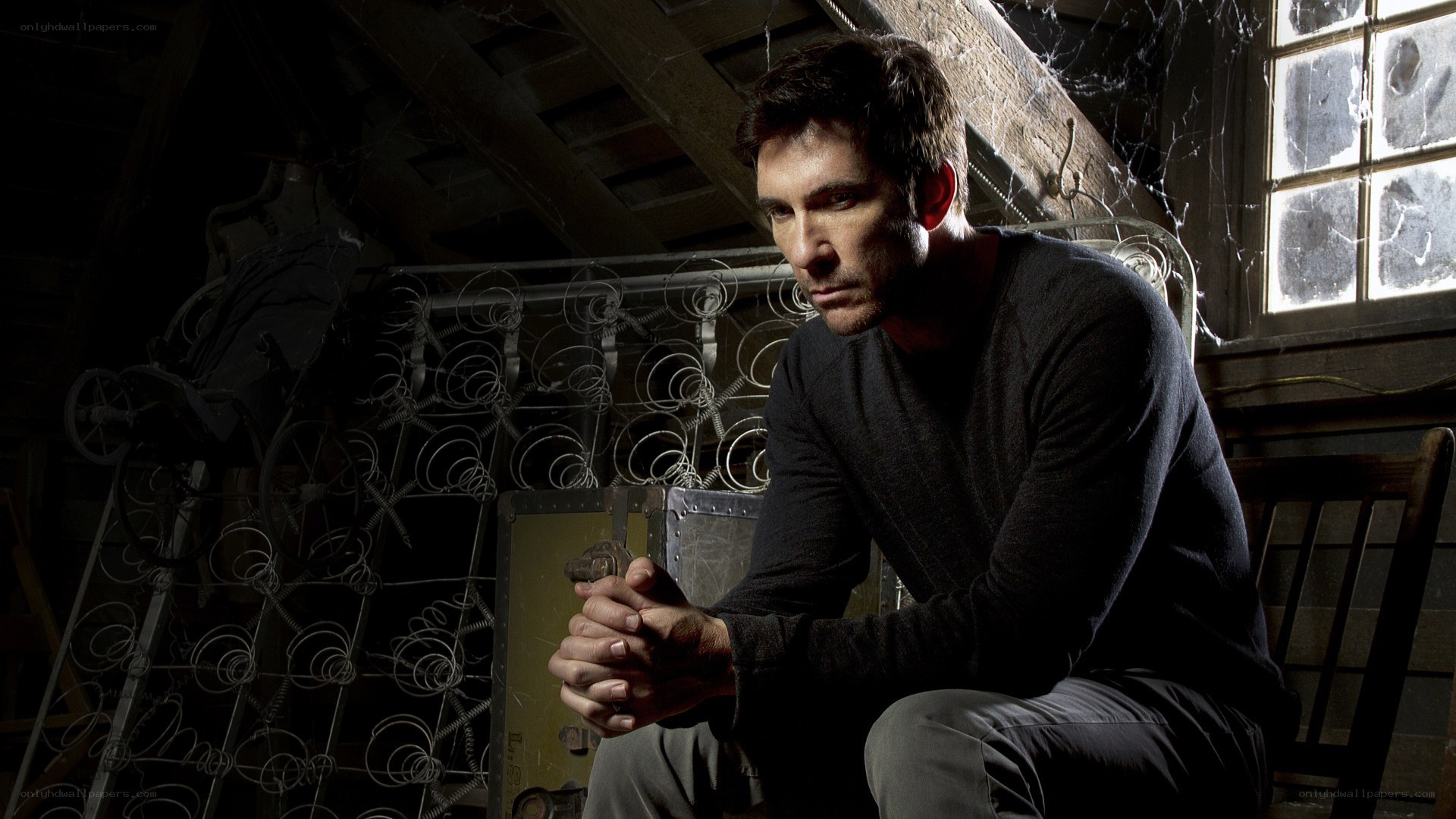 man sitting in attic