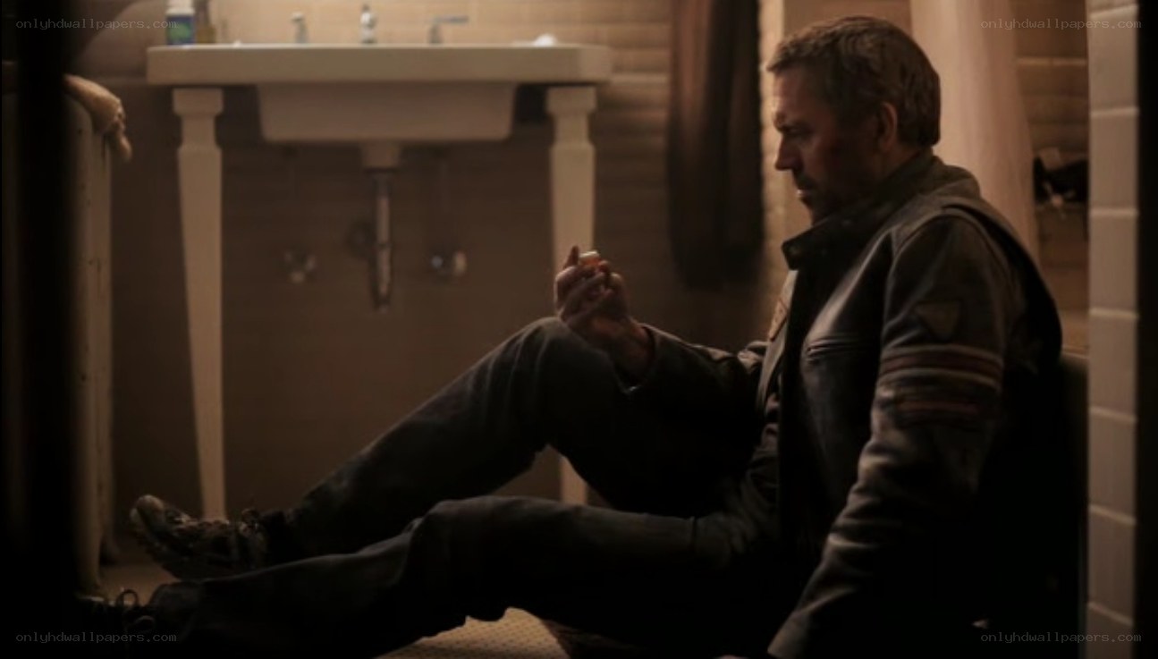 man sitting in bathroom