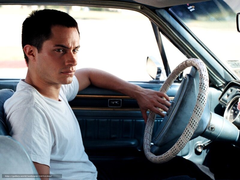 man sitting in car interior