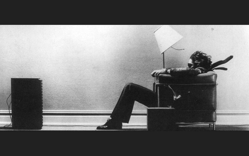 Man Sitting in Chair — Black, Contemplative, Photograph, Lamp, Speaker