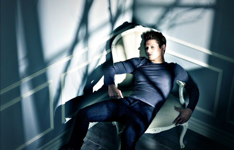 Man Sitting in Chair — Blue, Dramatic