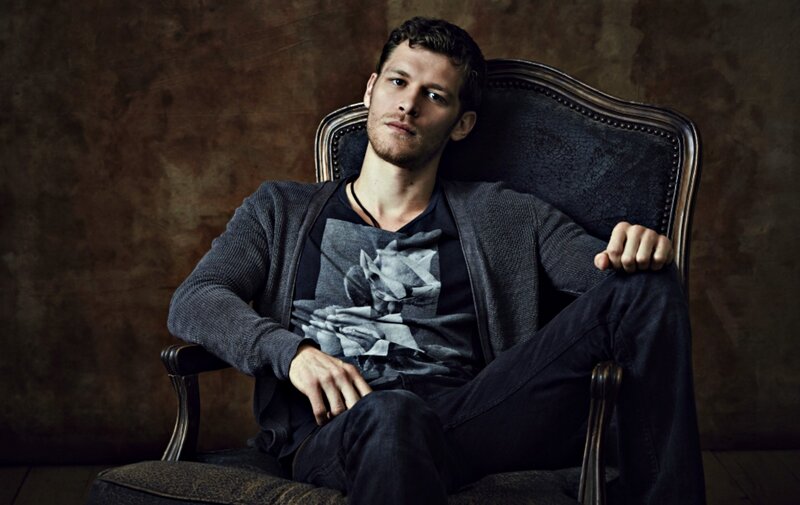 Man Sitting in Chair — Brown, Dramatic, Photograph
