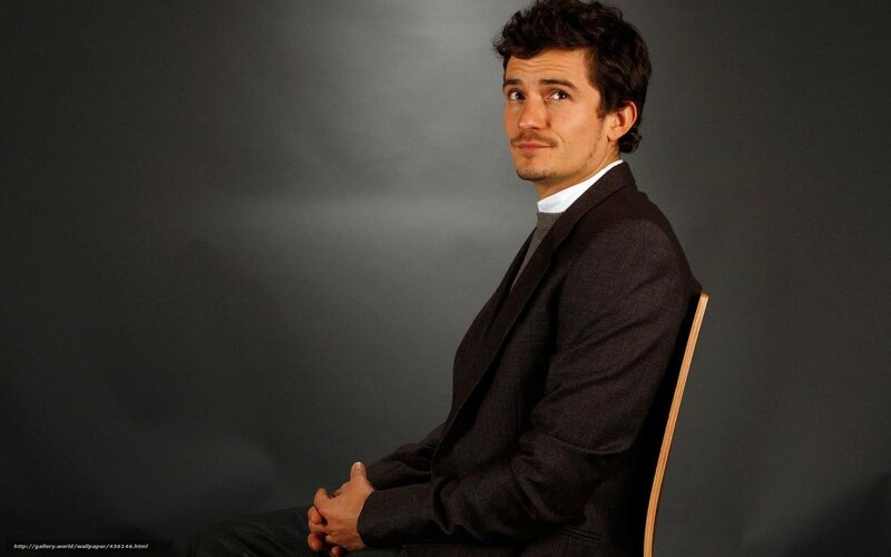 Man Sitting in Chair — Gray, Serious
