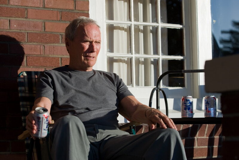 Man Sitting in Chair — Gray