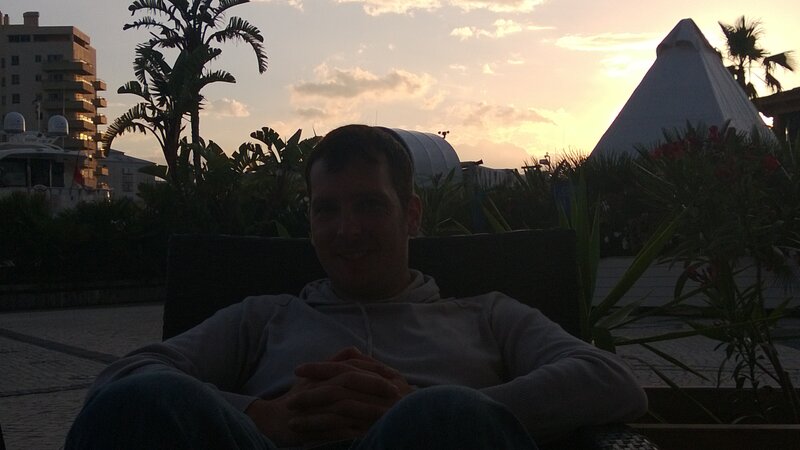 Man Sitting in Chair — Orange