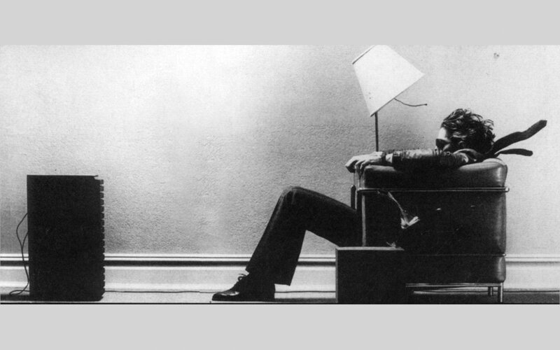 man sitting in chair with lamp
