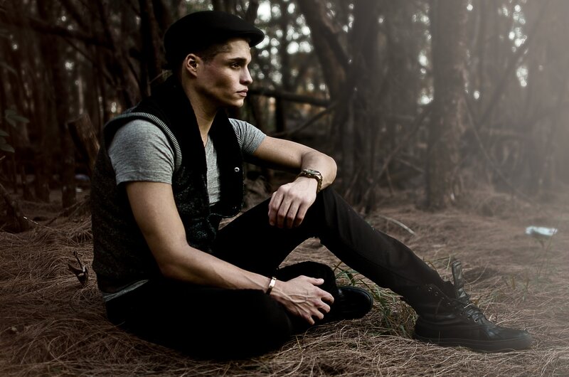 man sitting in forest