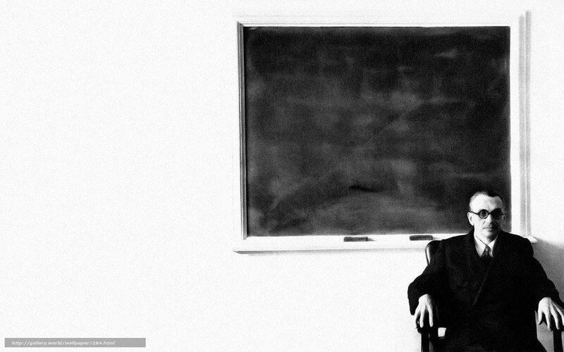Man sitting in front of a chalkboard