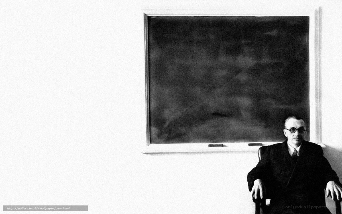 Man sitting in front of a chalkboard