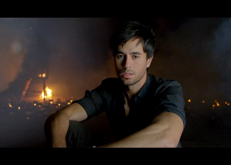 Man Sitting in Front of Fire
