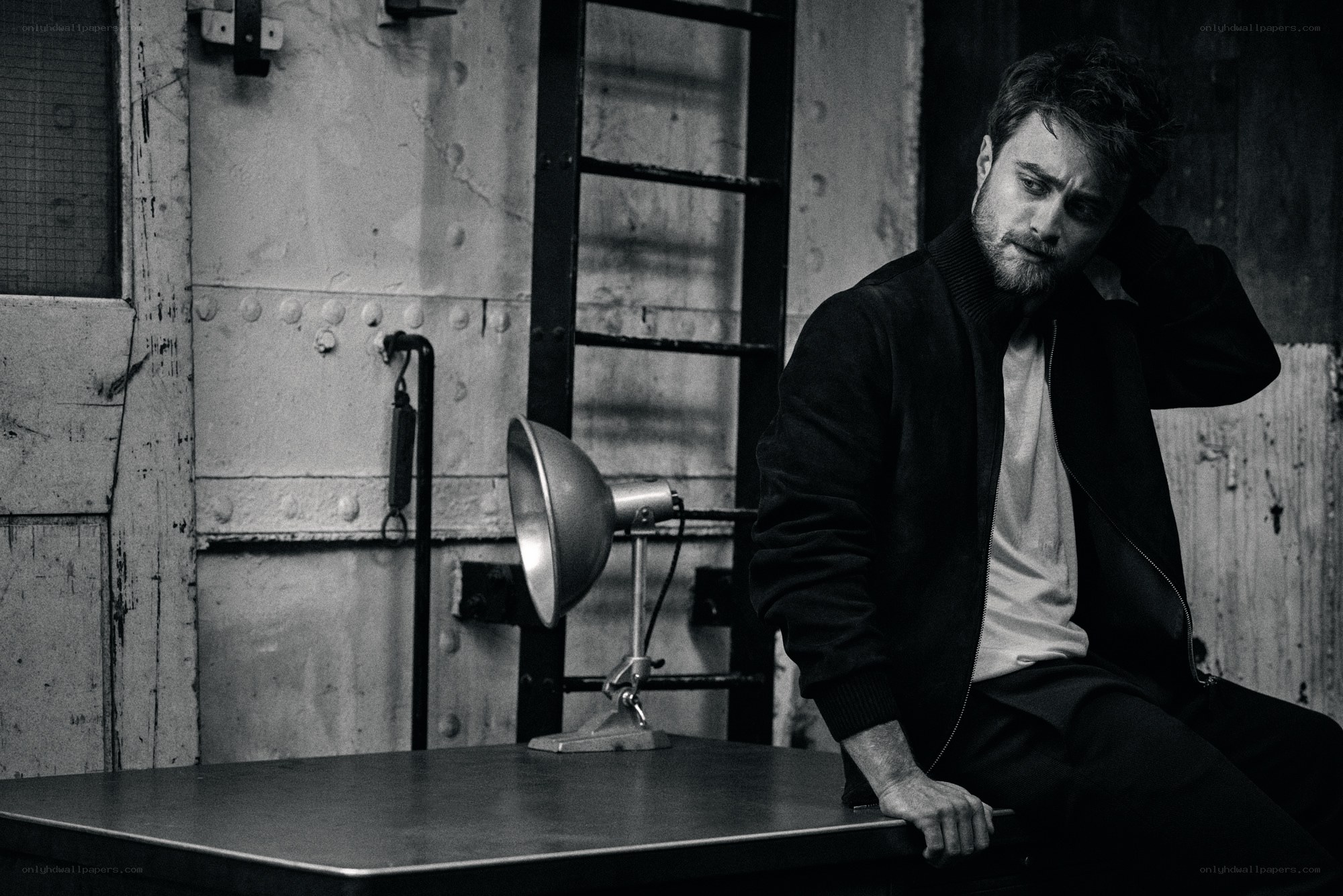 man sitting in industrial setting