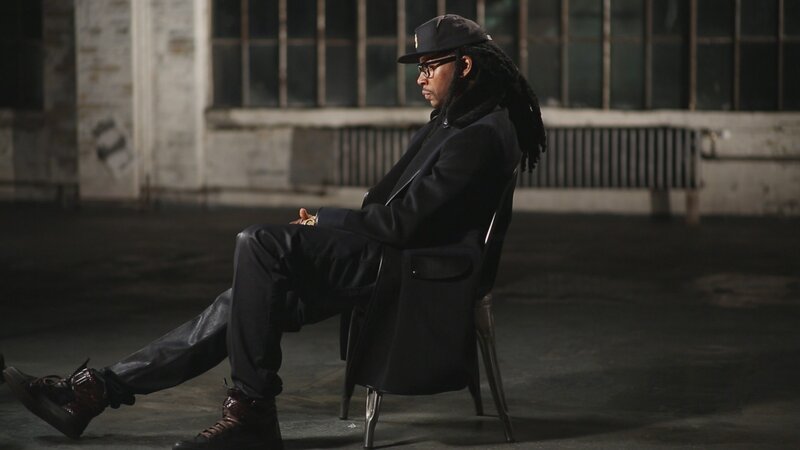 man sitting in industrial space