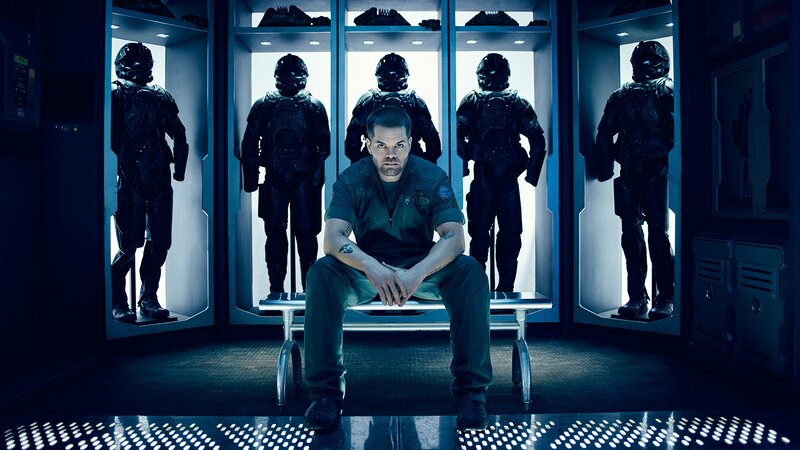 Man Sitting in Locker Room