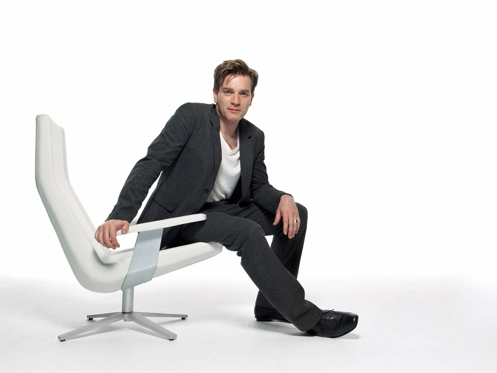 man sitting in modern chair