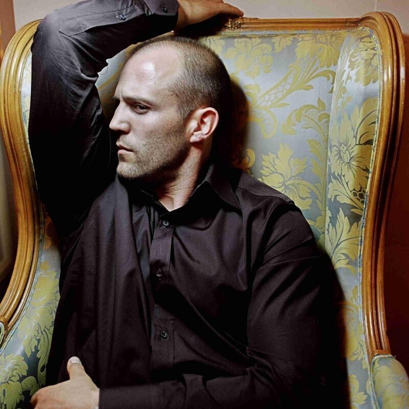 man sitting in ornate chair