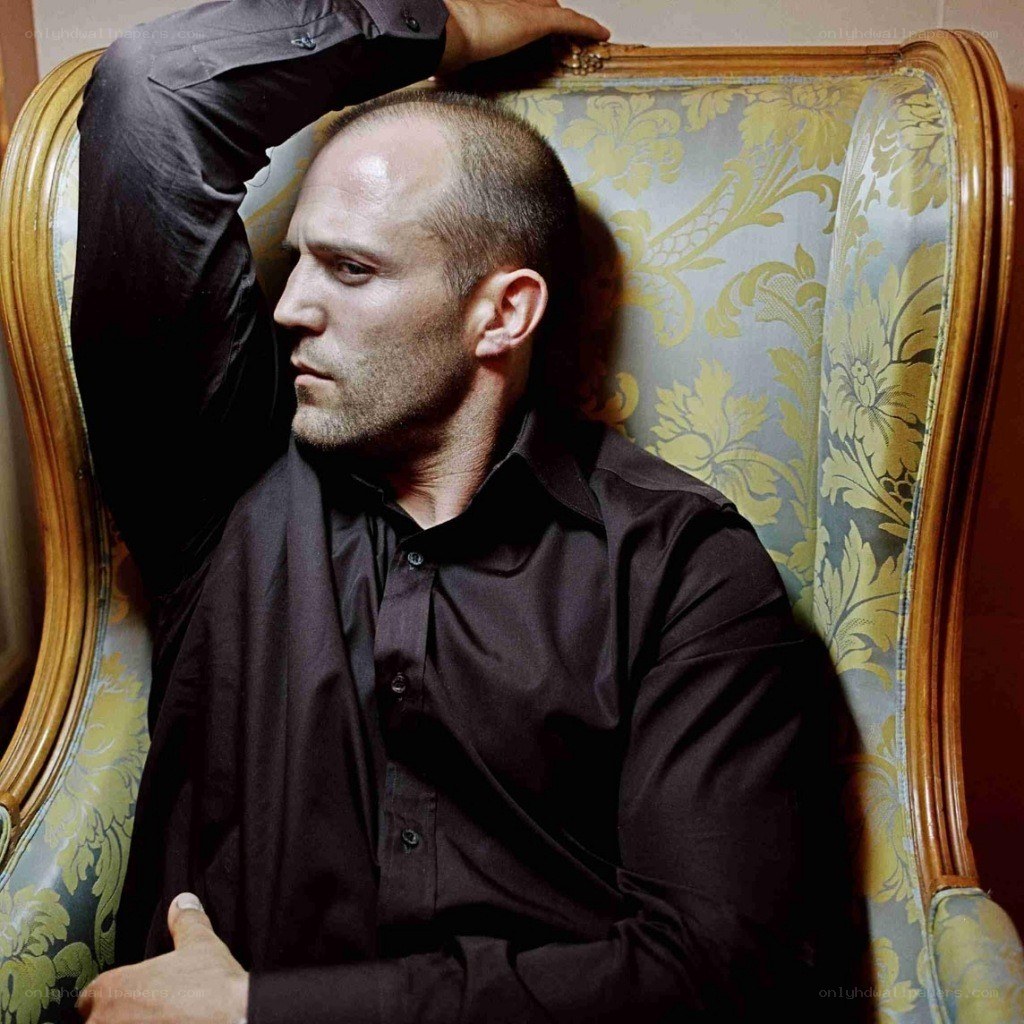 man sitting in ornate chair