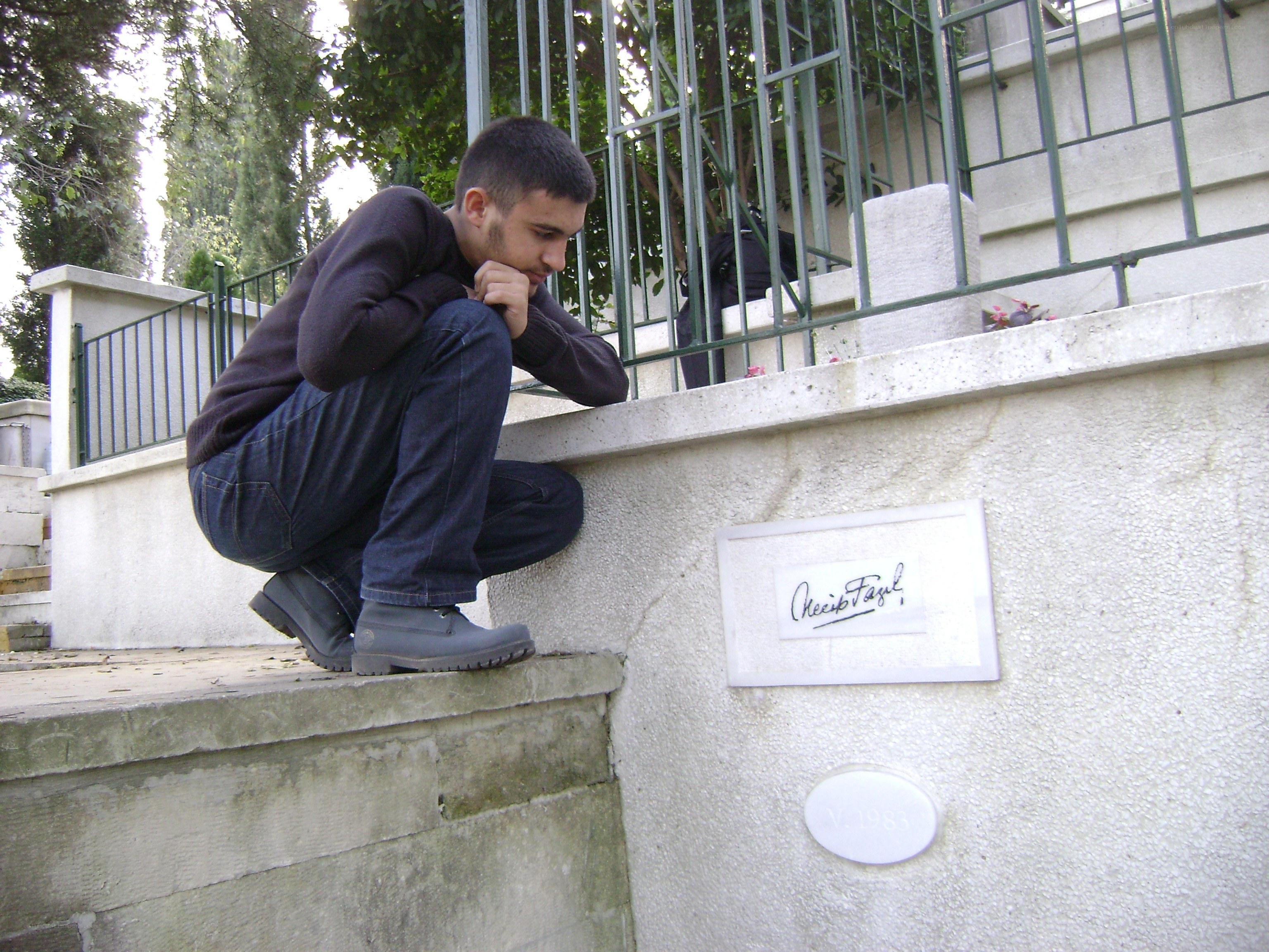 Man sitting on a wall