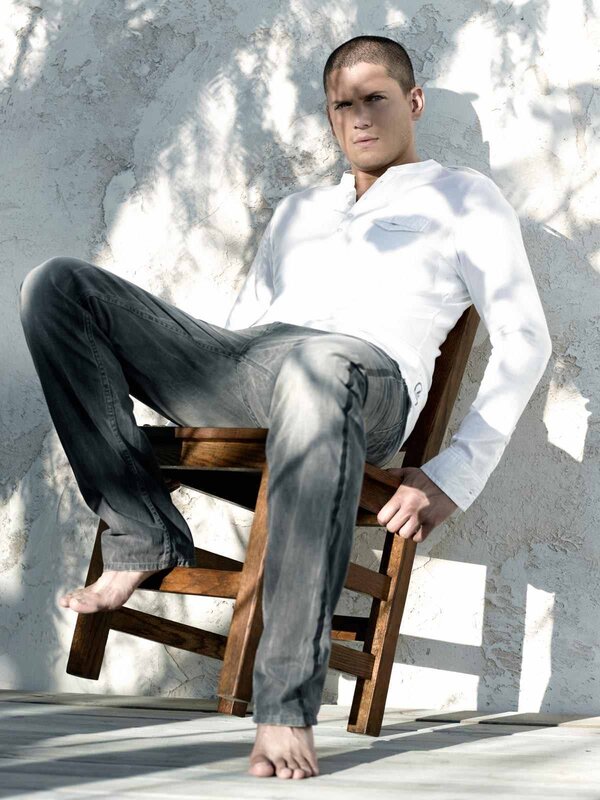 Man sitting on a wooden chair