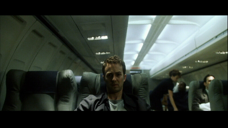 man sitting on airplane