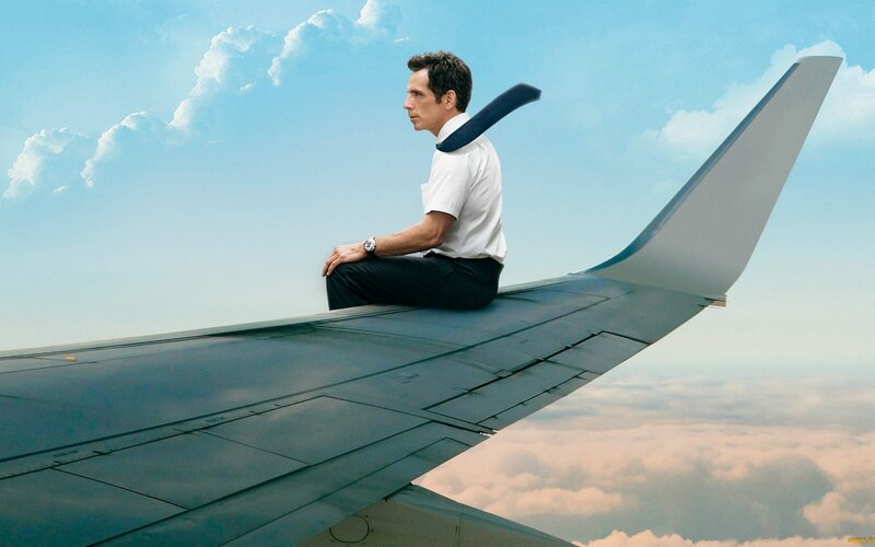 Man Sitting on Airplane Wing