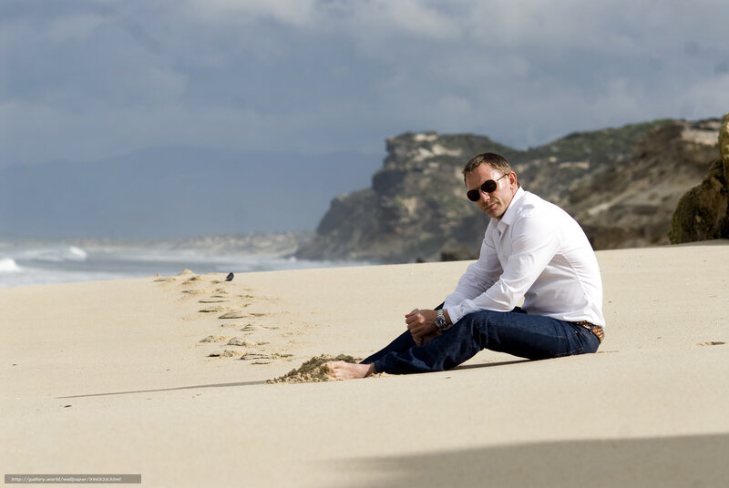 Man Sitting on Beach — Beige, Dramatic
