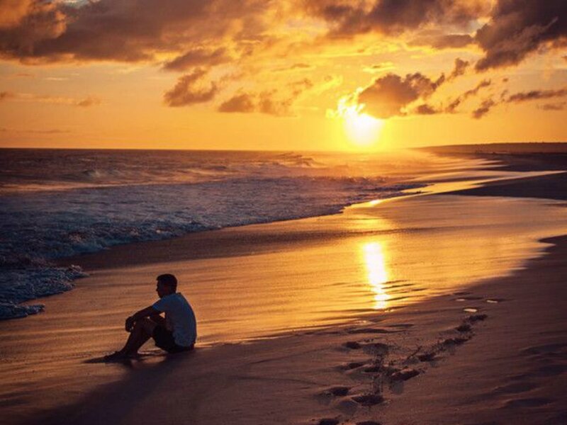 Man Sitting on Beach — Orange