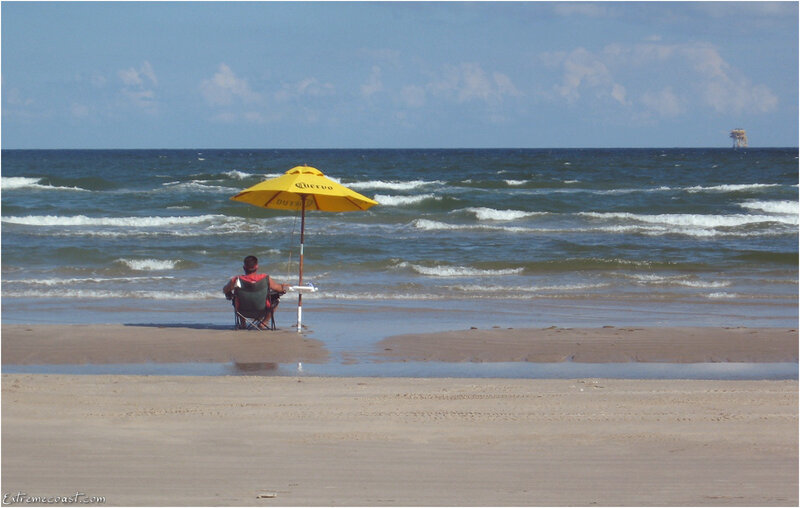 Man Sitting on Beach — Yellow, Calm