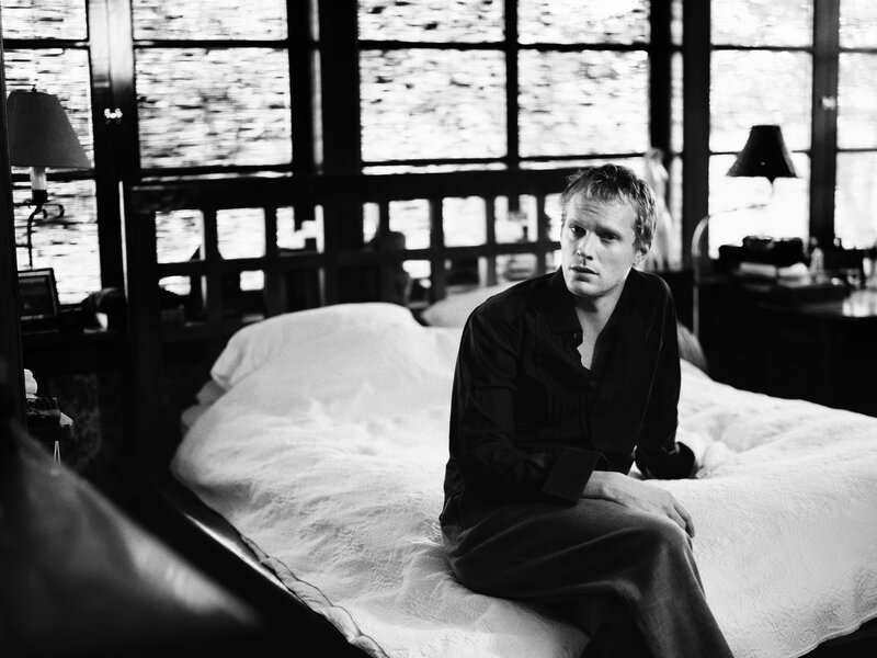 Man Sitting on Bed — Black, Contemplative