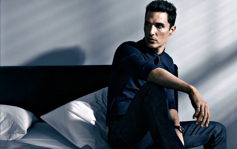 Man Sitting on Bed — Blue