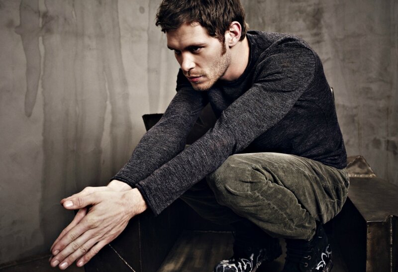 Man Sitting on Bench — Gray, Serious