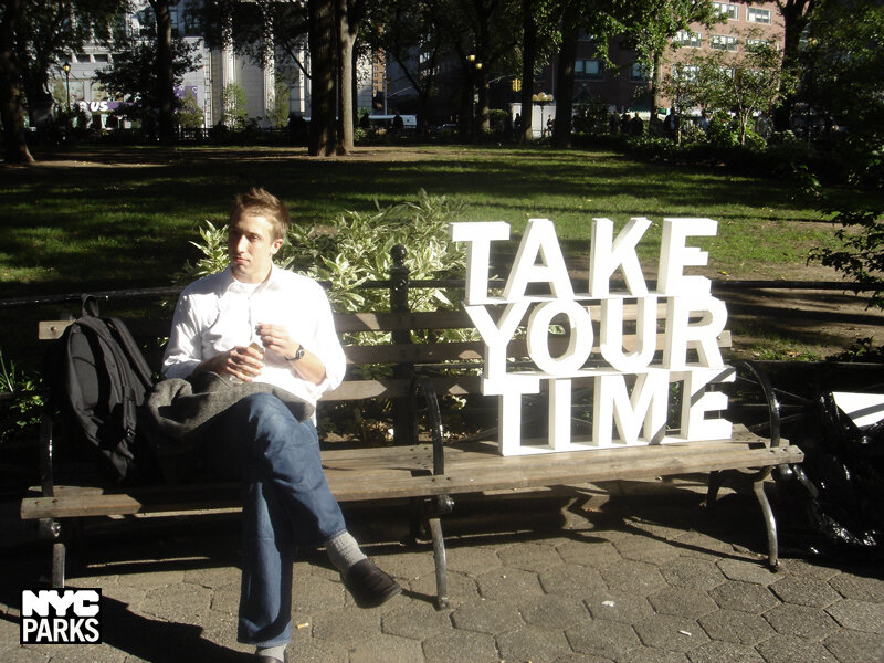 Man Sitting on Bench — Green