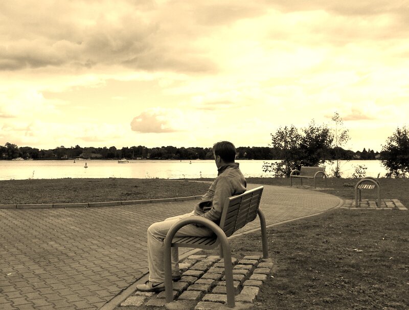 Man Sitting on Bench — Sepia